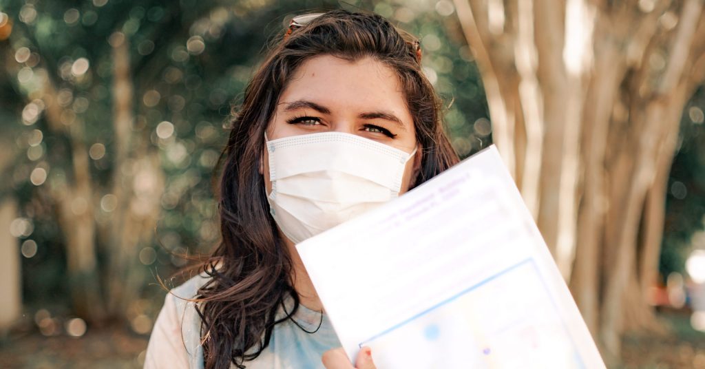 IDignity client Alex shows off the paperwork she's taking to the Health Department so she can get her son's birth certificate.